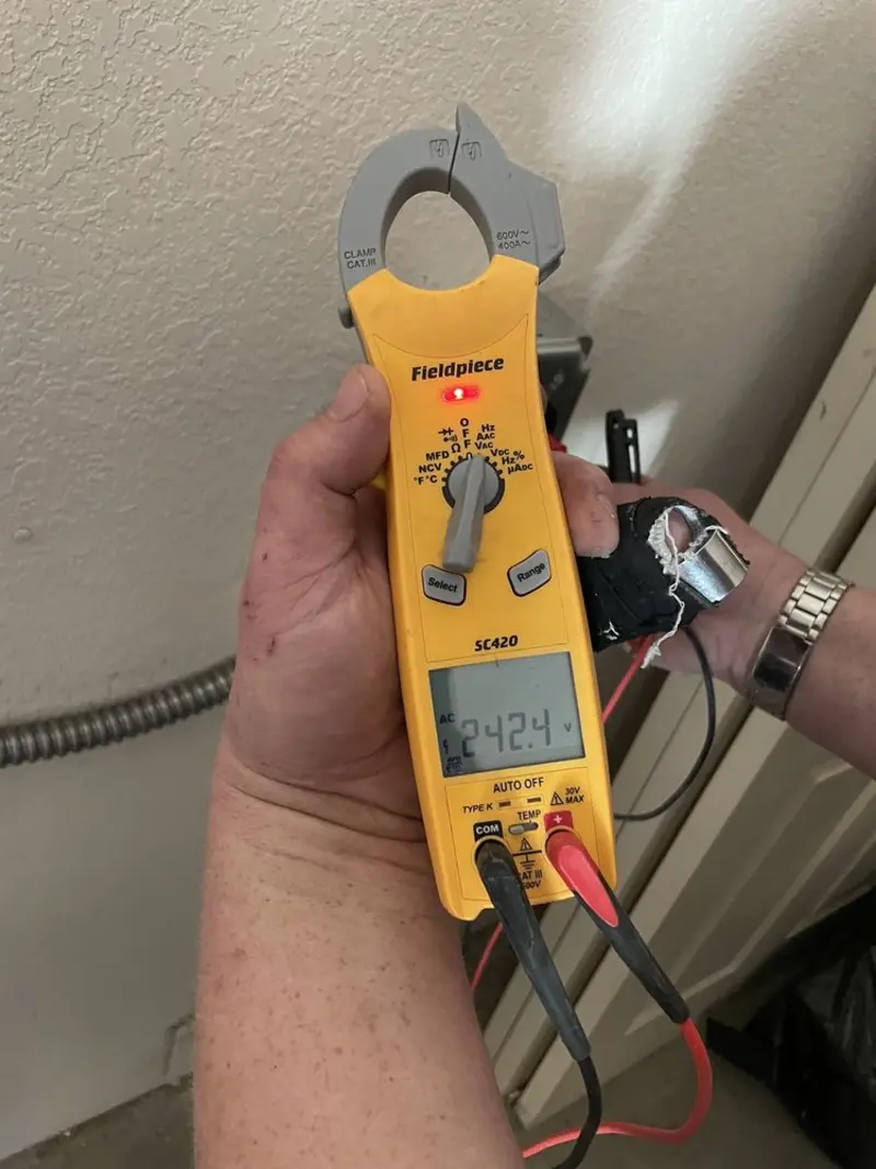 Voltage testing with clamp meter during Outlet Installation in Lucedale